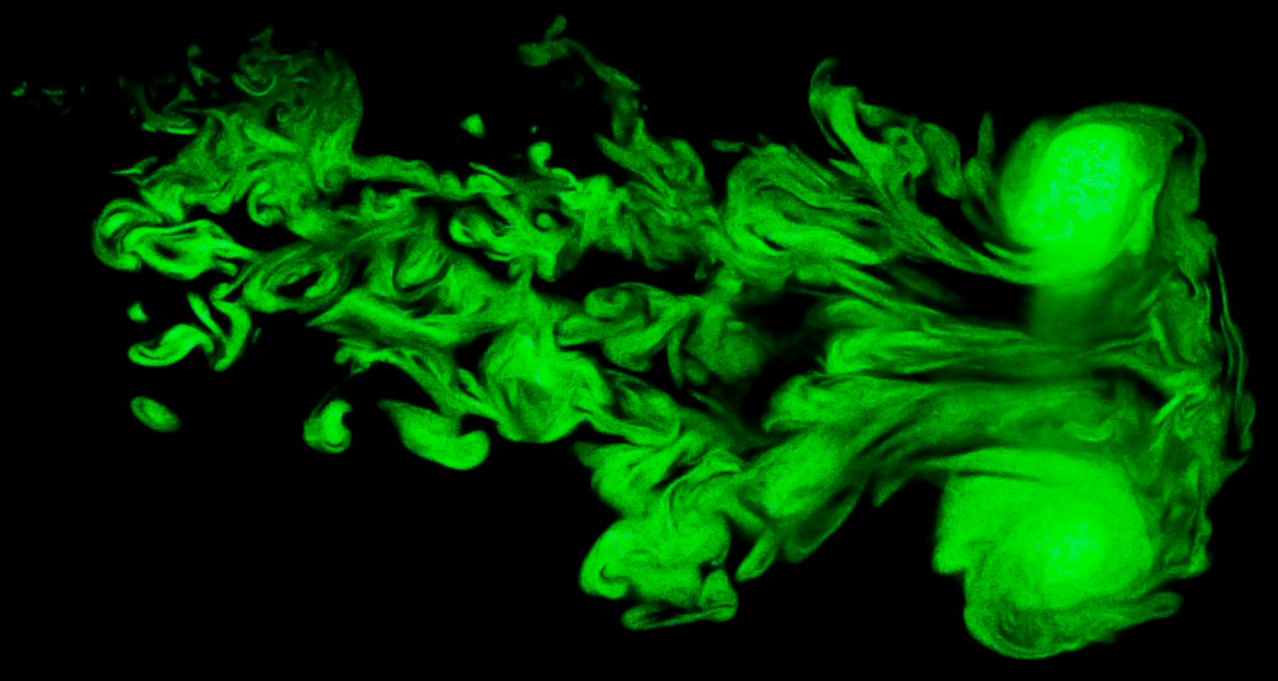 <strong>Figure 2.</strong> A laser illuminates turbulence in water vapor from a fog machine, showing the self-similarity in vortices from large scales to microscopic distances. Models must account for atmospheric turbulence to characterize the drivers of extreme weather events. Figure courtesy of <a href="https://www.flowvis.org/2013/12/10/a-turbulent-stage-fog-vortex-ring-illuminated-with-a-sheet-of-laser-light/" target="_blank">Jeffrey Pilkington and Alex Meyer</a>.