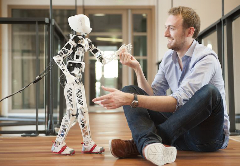 The design of humanoid robots for rich, safe interactions with everyday environments and humans requires techniques for online learning of sensorimotor and social control skills. The open-source 3D-printed humanoid robot Poppy shown here allows systematic experimentation in the integration of such learning methods with adequately designed morphologies (http://www.poppy-project.org; photo Inria/H. Raguet).