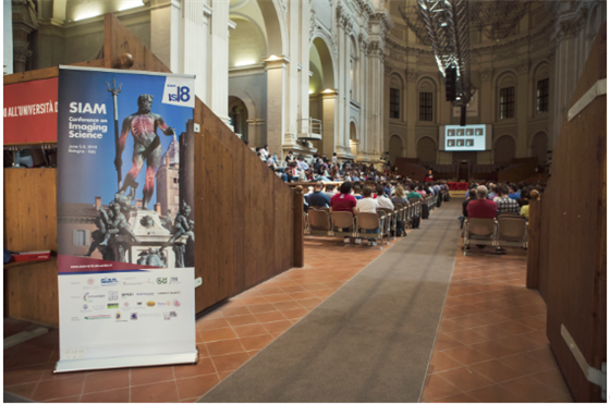 Opening Session at Aula Magna Santa Lucia. In the background is Raymond Chan, the first plenary speaker.