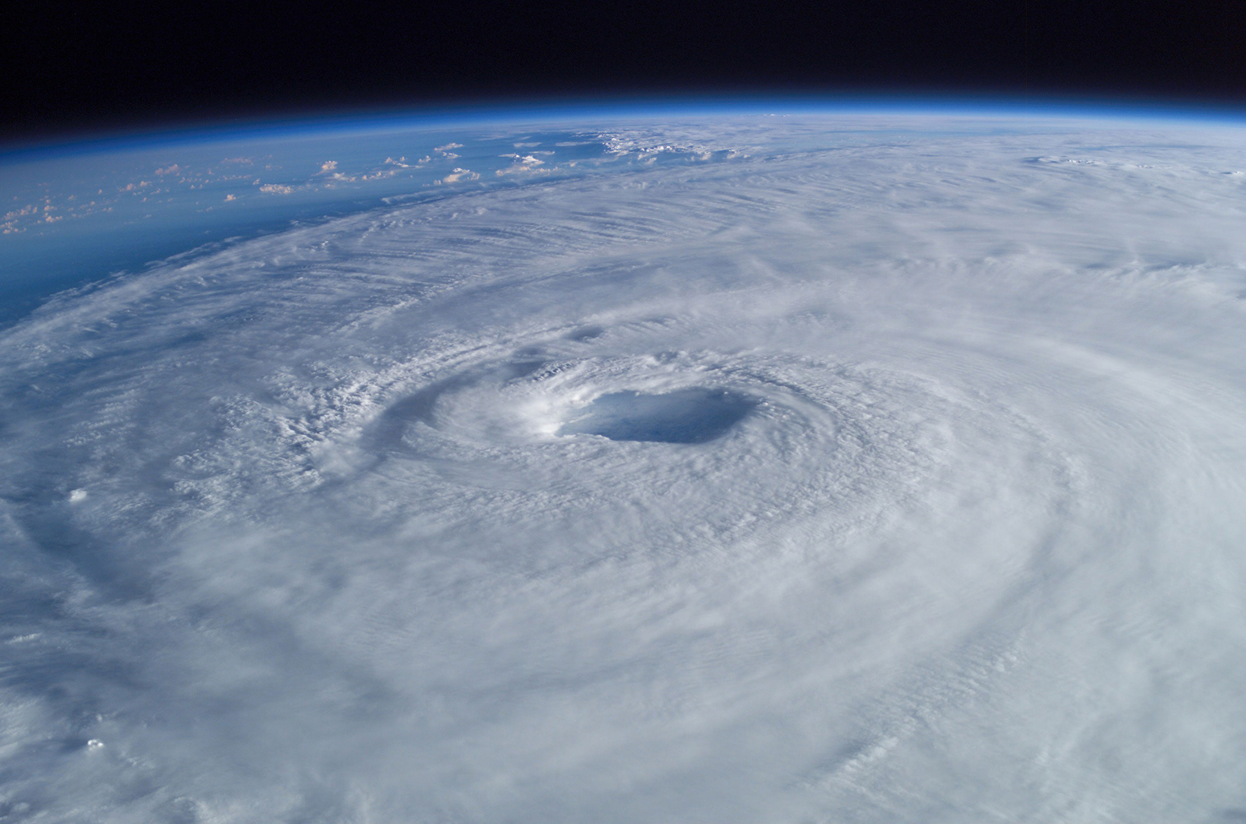 <strong>Figure 1.</strong> Hurricane Isabel in 2003, as seen from the International Space Station. Climate change is increasing the frequency and severity of hurricanes, but the exact mechanisms that drive these escalations are still unknown. Figure courtesy of <a href="https://eol.jsc.nasa.gov/SearchPhotos/photo.pl?mission=ISS007&amp;roll=E&amp;frame=14887" target="_blank">Mike Trenchard, Earth Sciences and Image Analysis Laboratory, NASA Johnson Space Center</a>.