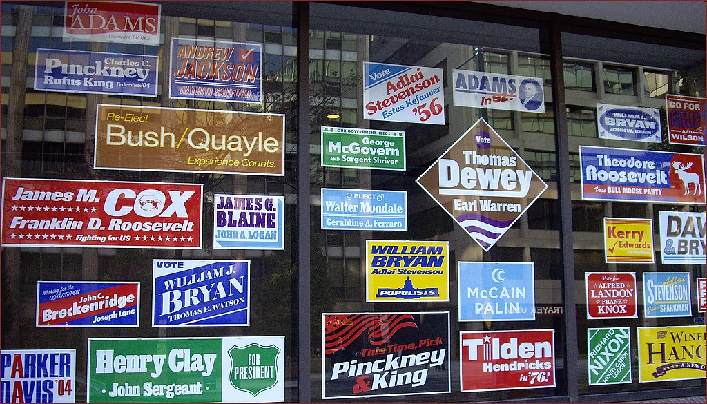 <strong>Figure 1.</strong> Campaign posters at the office of <i>The Washington Post</i>. Figure courtesy of <a href="https://www.flickr.com/photos/22711505@N05/8170049901" rel="noopener noreferrer" target="_blank">Ron Cogswell and Flickr</a> under the <a href="https://creativecommons.org/licenses/by/2.0" rel="noopener noreferrer" target="_blank">Attribution 2.0 Generic (CC BY 2.0) license</a>.