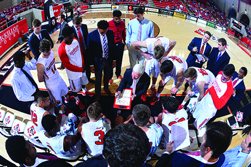 Davidson College basketball team planning their game strategy. Photo credit: Tim Cowie(DavidsonPhotos.com).