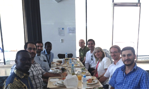 SRI-UQ and SIAM. Clockwise from front left: Ben Mansour Dia, Alvaro Moraes, Pedro Vilanova, Hamidou Tembine, Hakon Hoel, SRI-UQ director Raul Tempone, SIAM president Irene Fonseca, Kody Law, and Bilal Saad.