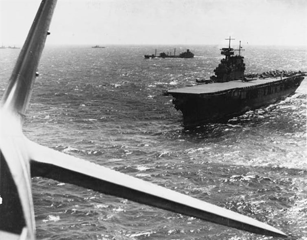 Yorktown conducts aircraft operations in the Pacific Ocean sometime before the Battle of the Coral Sea in the spring of 1942. A fleet oiler is in the near background. Image courtesy of the U.S. Navy.