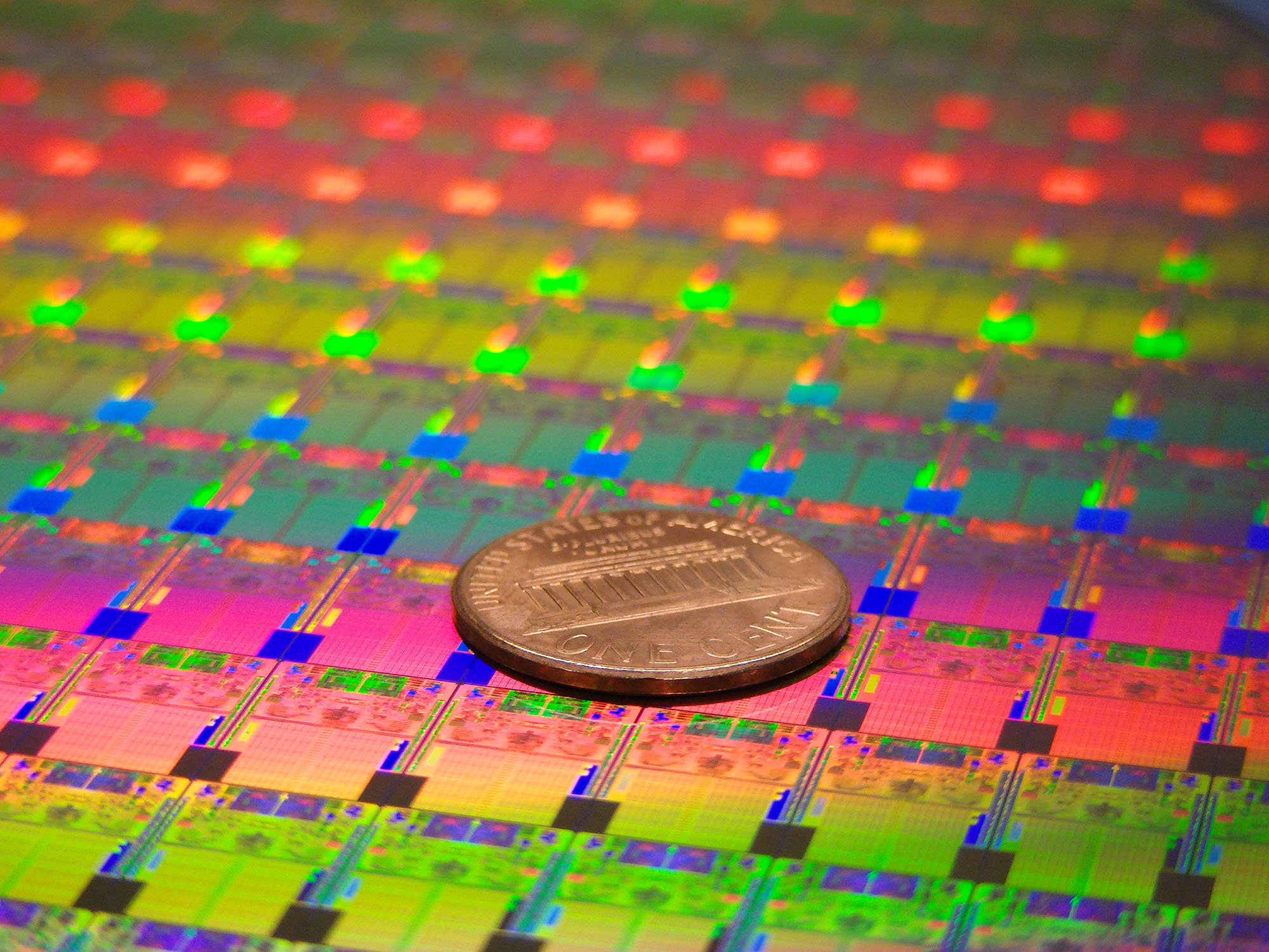 <strong>Figure 3.</strong> Intel's 300mm 45nm wafers like the one shown here are used to make its newest dual and quad-core processors that are made up of hundreds of millions of the company's new 45nm transistors with Hafnium-based high-k metal gate silicon technology. Photo credit: Intel Newsroom.