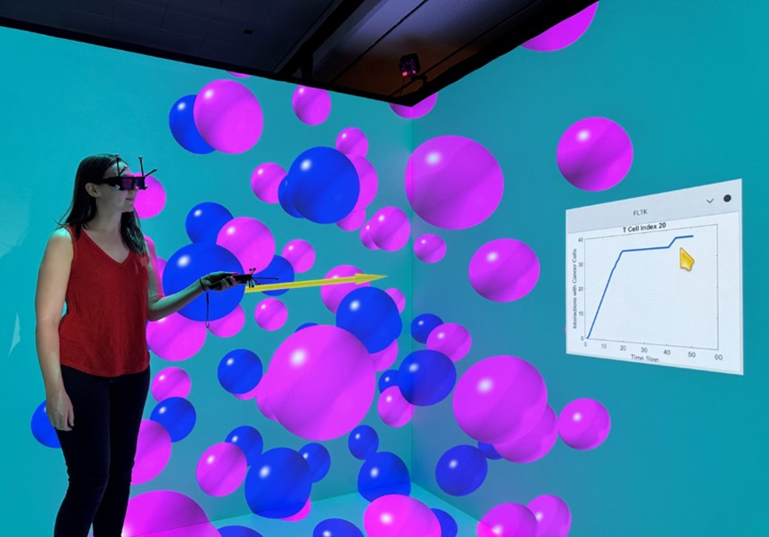 <strong>Figure 3.</strong> Immersive rendering of the virtual tumor microenvironment through the cave automatic virtual environment system at the National Institute of Standards and Technology. Figure adapted from [12]. 