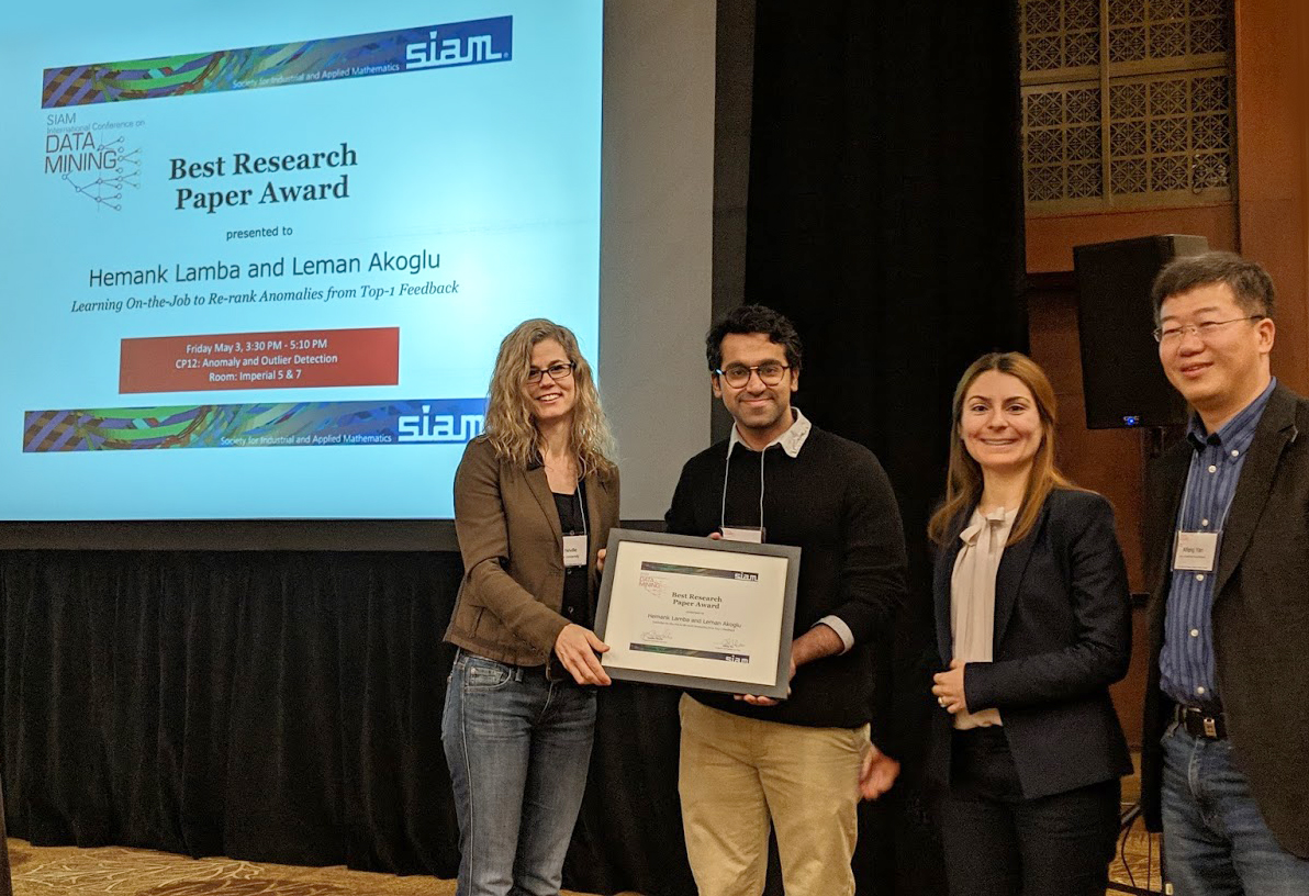 Hemank Lamba (second from left) and Leman Akoglu (third from left) of Carnegie Mellon University receive the Best Research Paper Award from Conference Program Co-chairs Jennifer Neville (Purdue University) and Xifeng Yan (University of California, Santa Barbara) at the &lt;a href=&quot;https://www.siam.org/conferences-events/past-event-archive/sdm19/&quot;&gt; 2019 SIAM International Conference on Data Mining&lt;/a&gt;, which took place in Calgary, Alberta, Canada in early May. Their paper and presentation were titled &lt;a href=https://meetings.siam.org/sess/dsp_talk.cfm?p=100565&gt;&quot; “Learning On-the-Job to Re-Rank Anomalies from Top-1 Feedback.” &lt;/a&gt; Photo courtesy of Tanya Berger-Wolf.