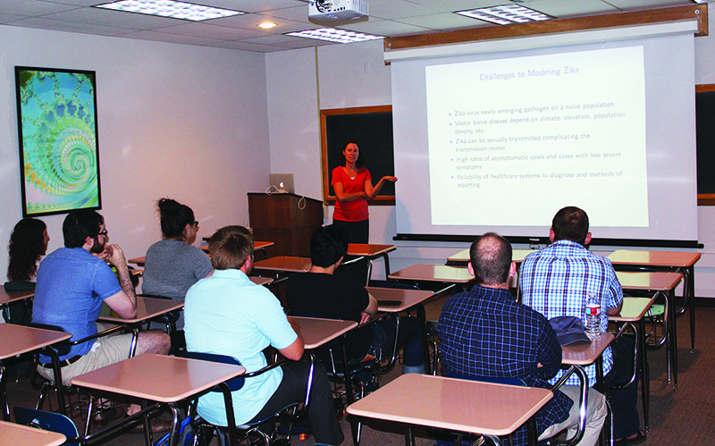A fourth-year Ph.D. student at the Colorado School of Mines presents a seminar about her summer internship research at Los Alamos National Laboratory to incoming Ph.D. students. Photo credit: Stephen Pankavich.