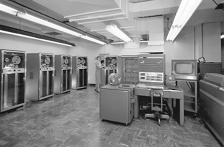<strong>Figure 1.</strong> The mainframe of an IBM 704: a state-of-the-art, high-speed digital computer in the late 1950s. Figure courtesy of Lawrence Livermore National Laboratory via <a href="https://commons.wikimedia.org/wiki/File:IBM_704_mainframe.gif" rel="noopener noreferrer" target="_blank">Wikimedia Commons</a>.