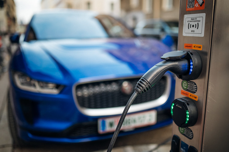 Close-up view of an electric vehicle (EV) charging station. A robust charging infrastructure is necessary to accommodate the growing adoption of EVs in the U.S. Figure courtesy of <a href="https://www.flickr.com/photos/26344495@N05/50924905168/" target="_blank">Ivan Radic/Flickr</a> via the <a href="https://creativecommons.org/licenses/by/2.0/" target="_blank">Creative Commons Attribution 2.0 Generic license.</a>