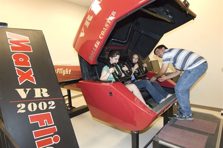 An instructor at Clarkson University’s summer rollercoaster camp prepared two participants to test their design on the Max Flight VR2002 Virtual Reality Programmable Roller Coaster. Photo courtesy of Christopher Lenney, © Clarkson University.