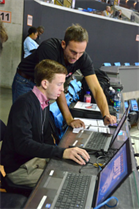 Patrick Bolton, an optical analyst for STATS LLC, guides Ross Kruse, Davidson College Class of ’17, in operating the SportVU system.