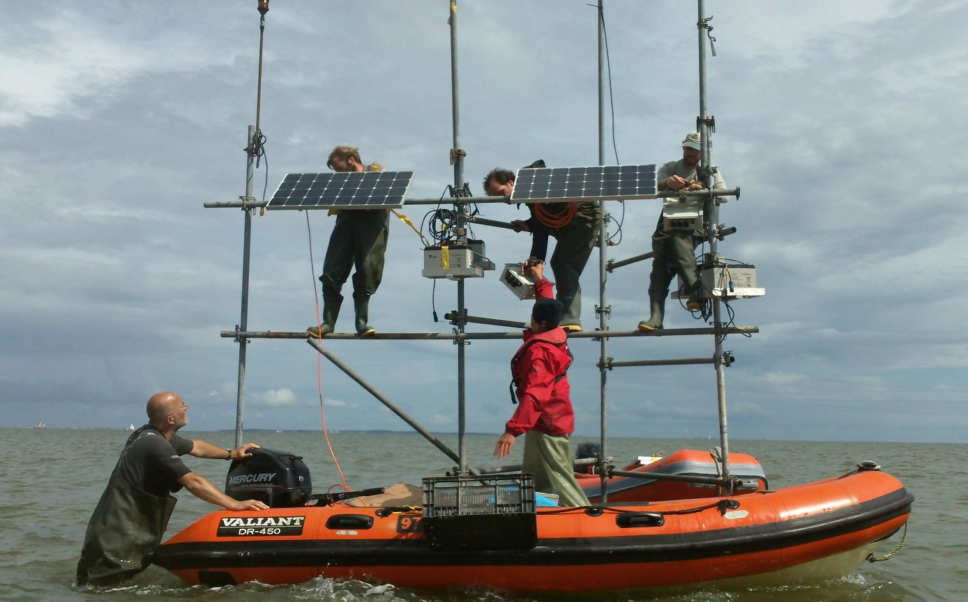 <strong>Figure 3.</strong> Researchers set up an ATLAS receiver in the Wadden Sea in the Netherlands. Photo courtesy of the Royal Netherlands Institute for Sea Research.