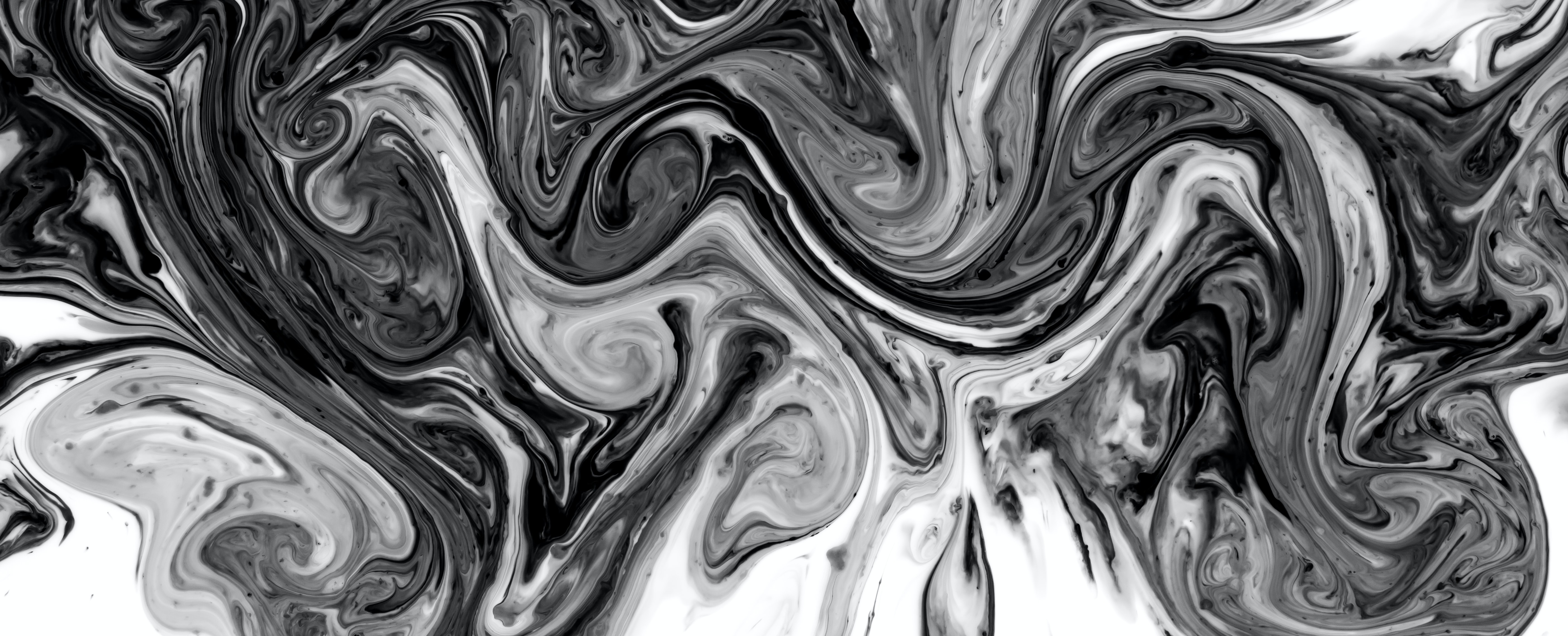 <strong>Figure 1.</strong> Chaotic mixing creates self-similar “swiss roll” patterns that lead to the Batchelor spectrum. Photo courtesy of Dan-Cristian Pădureț on Unsplash.