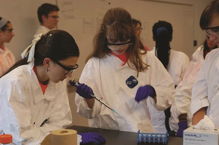 Eighth-grade girls participated in Rochester Institute of Technology’s SMASH program, gaining first-hand lab experience. After reviewing a lesson on ratios, the students created serial dilutions for an enzyme-linked immunosorbent assay. The next step was fitting the ELISA data to a line to help with a crime scene investigation. Photo courtesy of SMASH.
