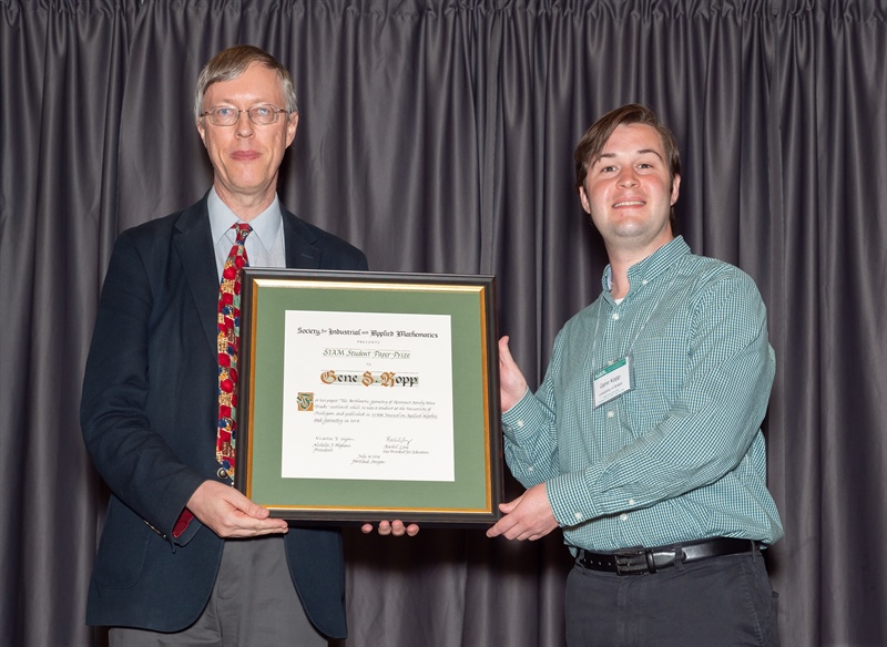Gene S. Kopp (right) of the University of Bristol was awarded the SIAM Student Paper Prize from SIAM President Nick Higham (left) at the 2018 SIAM Annual Meeting.