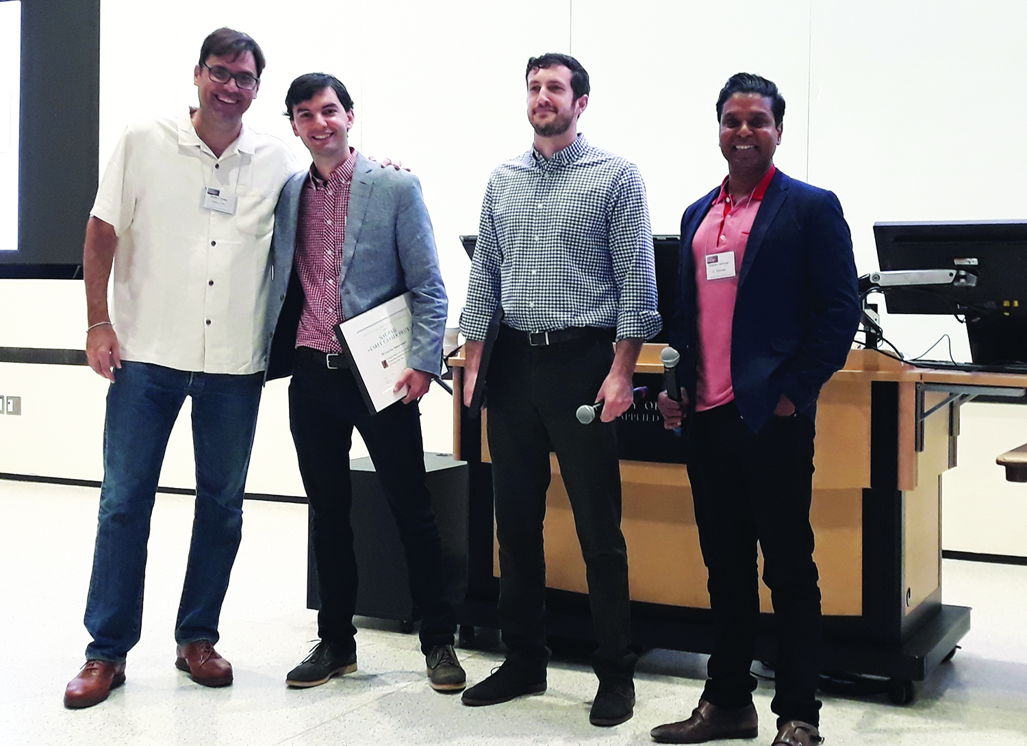 Alvaro Cartea of the University of Oxford (far left), invited speaker at the 2019 SIAM Conference on Financial Mathematics & Engineering, and Sebastian Jaimungal of the University of Toronto (far right), organizing committee co-chair, pose with SIAM Activity Group on Financial Mathematics and Engineering Early Career Prize winners Mykhaylo Shkolnikov of Princeton University (second from left) and Daniel Lacker of Columbia University (second from right). SIAM photo.