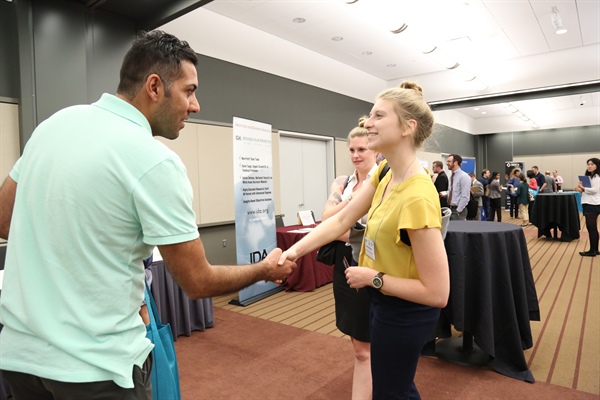 Job seekers interact with Career Fair exhibitors at the 2017 SIAM Annual Meeting in Pittsburgh, Pa.